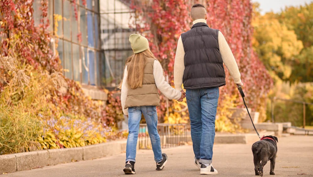 family going for a walk with dog